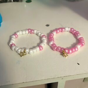 Pink and white plastic Kandi beads friendship bracelet with gold star, charms